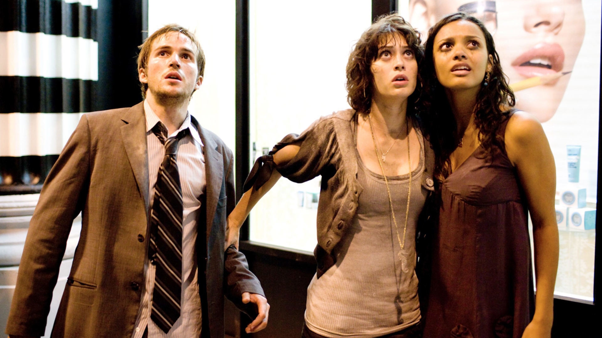 CLOVERFIELD, Michael Stahl-David, Lizzy Caplan, Jessica Lucas